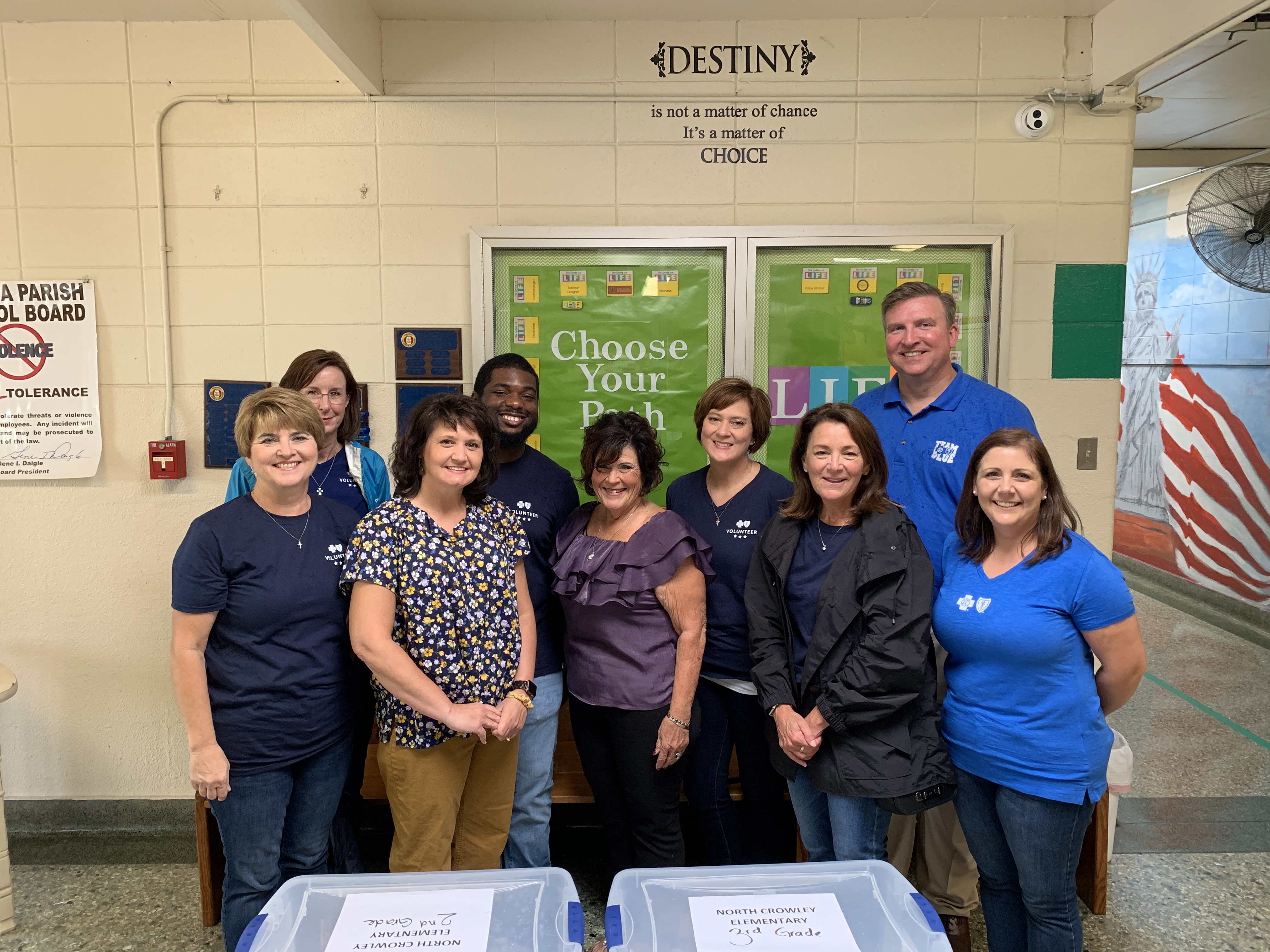 Volunteers pack boxes of school supplies at North Crowley Elementary School.